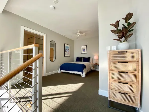 a bedroom with furniture and a window