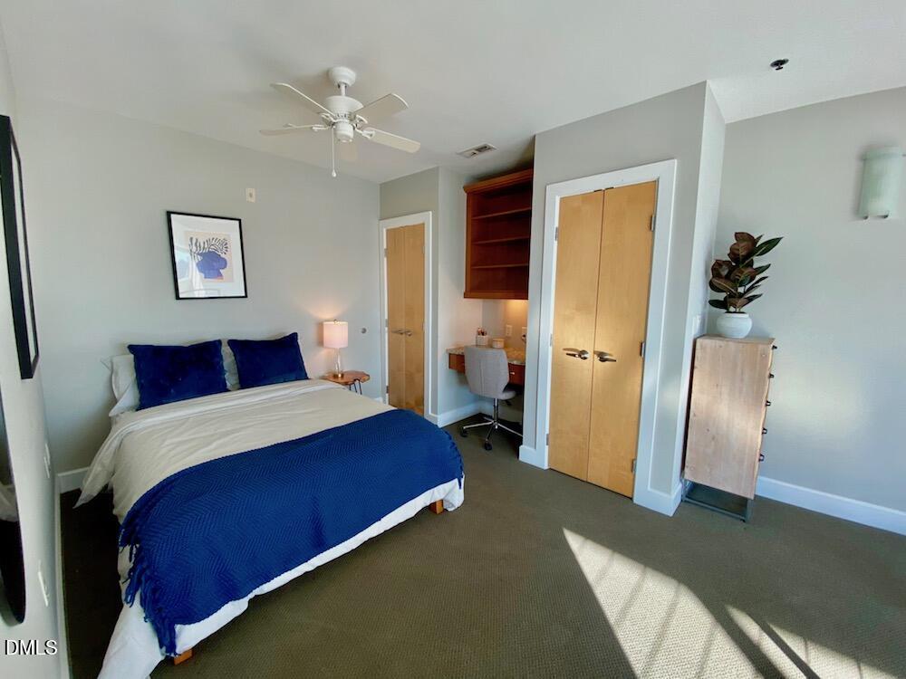 2608 Erwin Road, Unit 430 Durham, NC 27705 - Photo 29 of 43 a bedroom with a large bed and a chandelier