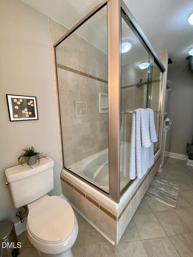 2608 Erwin Road, Unit 430 Durham, NC 27705 - Photo 32 of 43 a white toilet sitting next to a bathroom sink