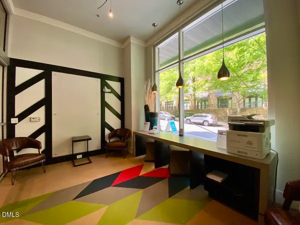 a room with furniture pool table and windows