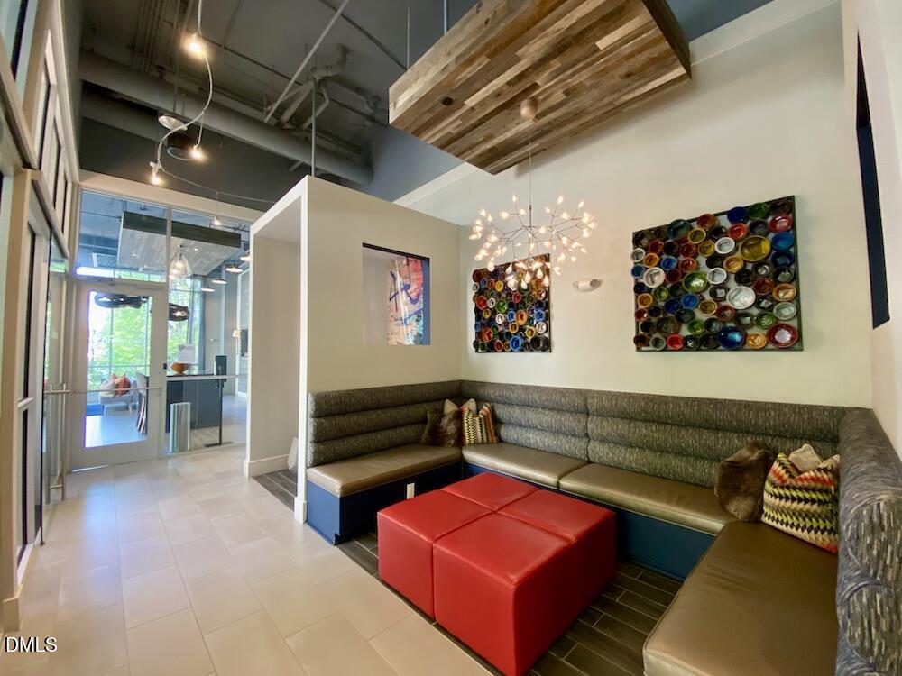 2608 Erwin Road, Unit 430 Durham, NC 27705 - Photo 35 of 43 a living room with furniture and a flat screen tv