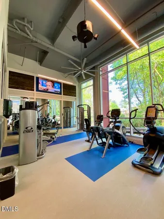 a living room with lots of furniture and a chandelier