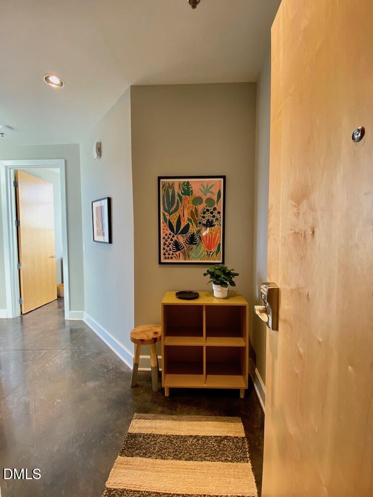 2608 Erwin Road, Unit 430 Durham, NC 27705 - Photo 4 of 43 a bedroom with a bed and a painting on the wall