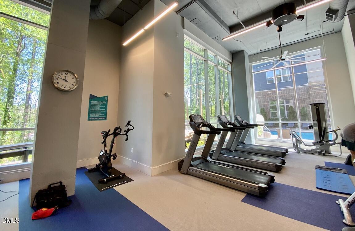 2608 Erwin Road, Unit 430 Durham, NC 27705 - Photo 41 of 43 a living room with furniture gym equipment and a large window