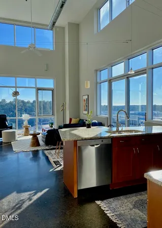 a view of living room with a floor to ceiling window and pool table