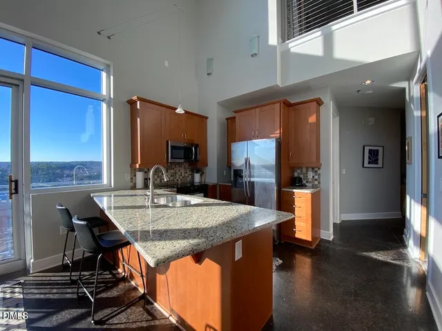 a view of kitchen island dining room cabinets and wooden floor