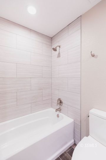 340 South Locust Street Ridgecrest, CA 93555 - Photo 26 of 32 a bathroom with a sink a toilet and bathtub