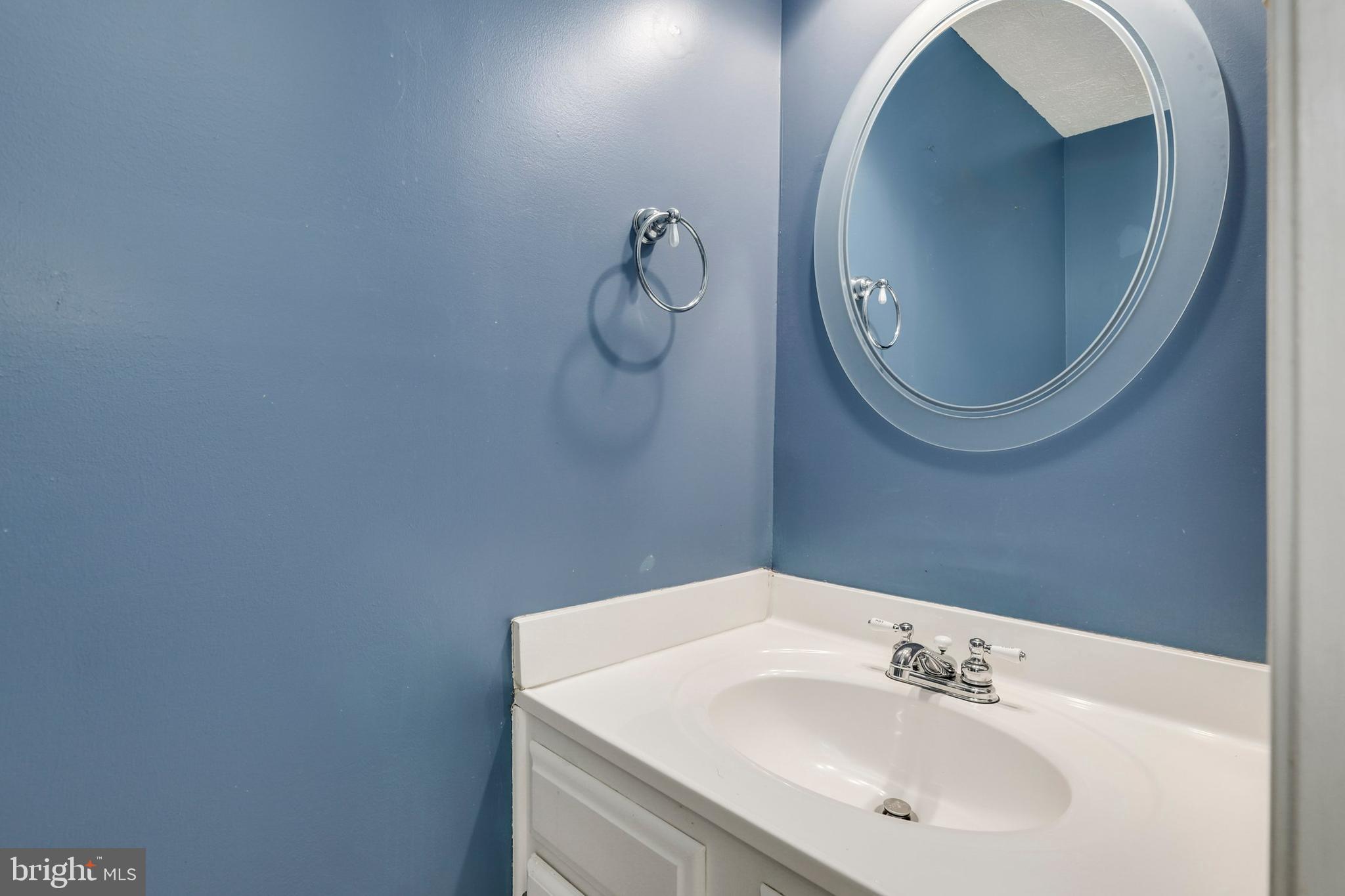 1349 David Lane Frederick, MD 21703 - Photo 12 of 24 a bathroom with a sink and mirror