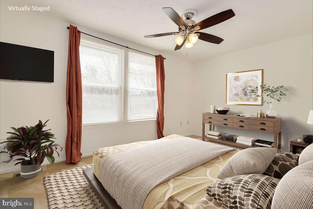 1349 David Lane Frederick, MD 21703 - Photo 13 of 24 a bedroom with a large bed and a window