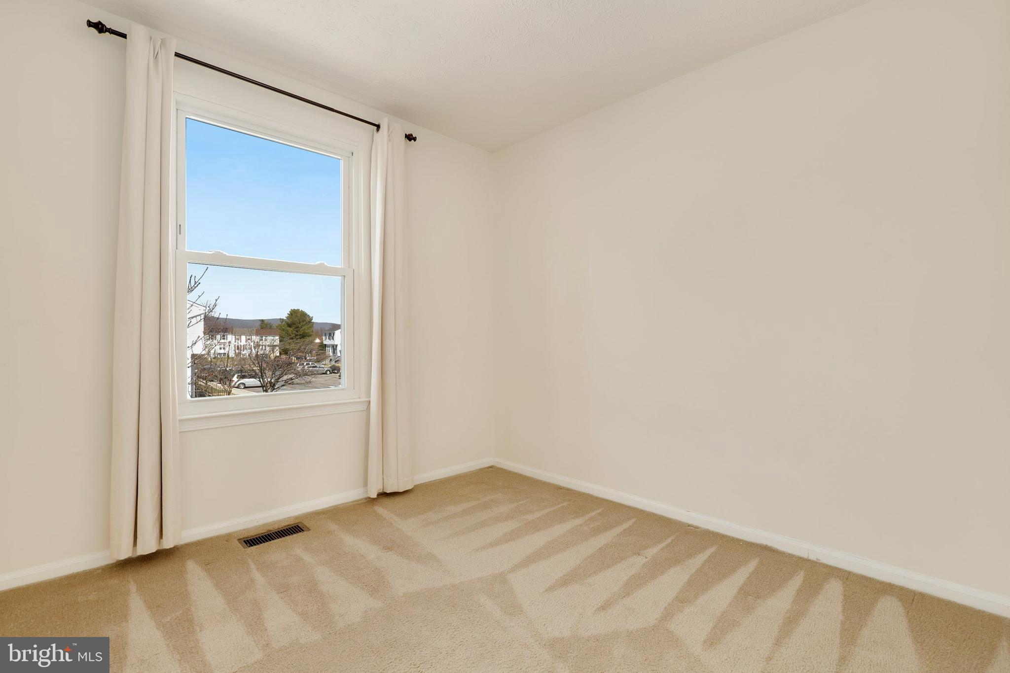 1349 David Lane Frederick, MD 21703 - Photo 19 of 24 a view of a small space with a wooden door