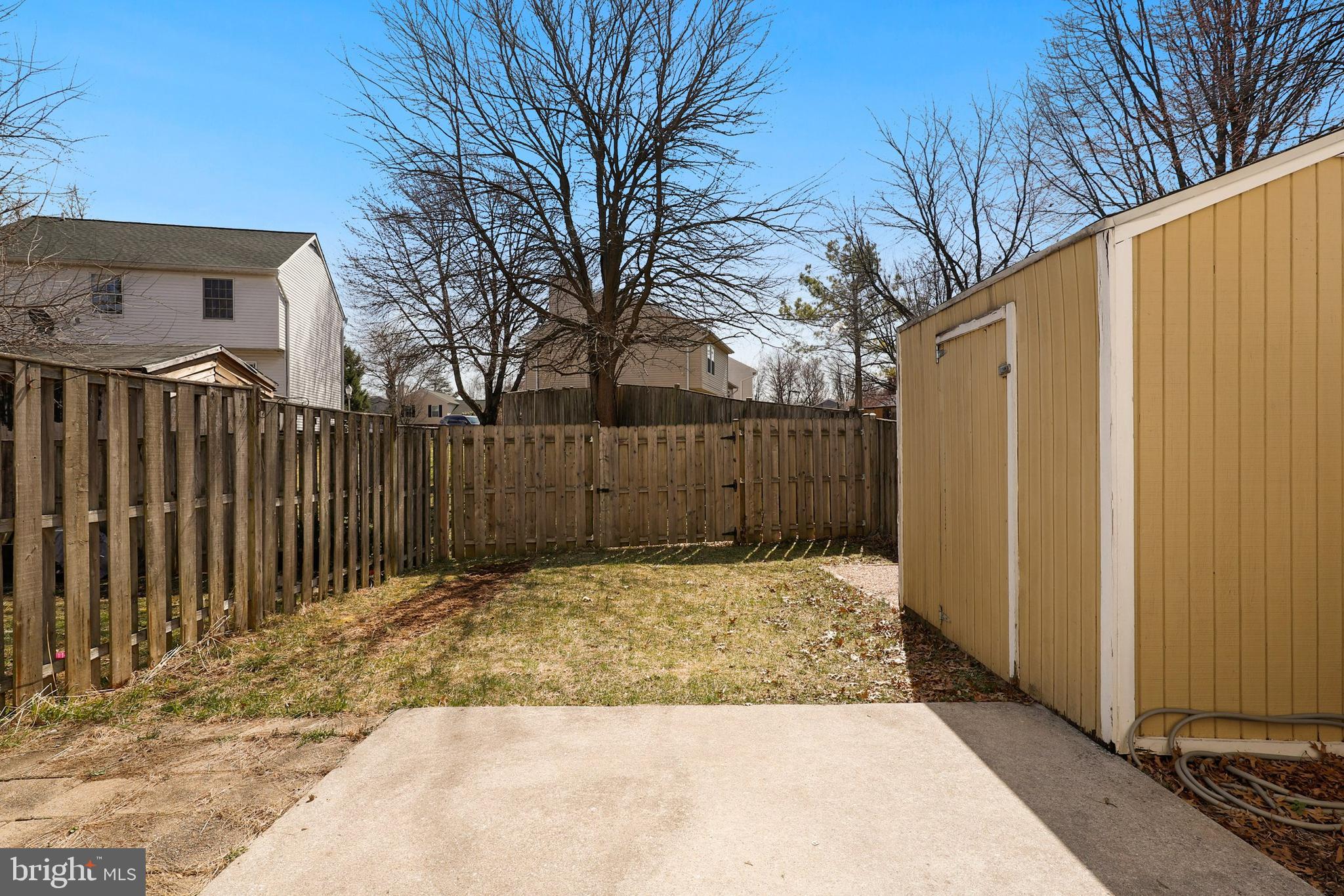 1349 David Lane Frederick, MD 21703 - Photo 21 of 24 a view of backyard with wooden fence and trees