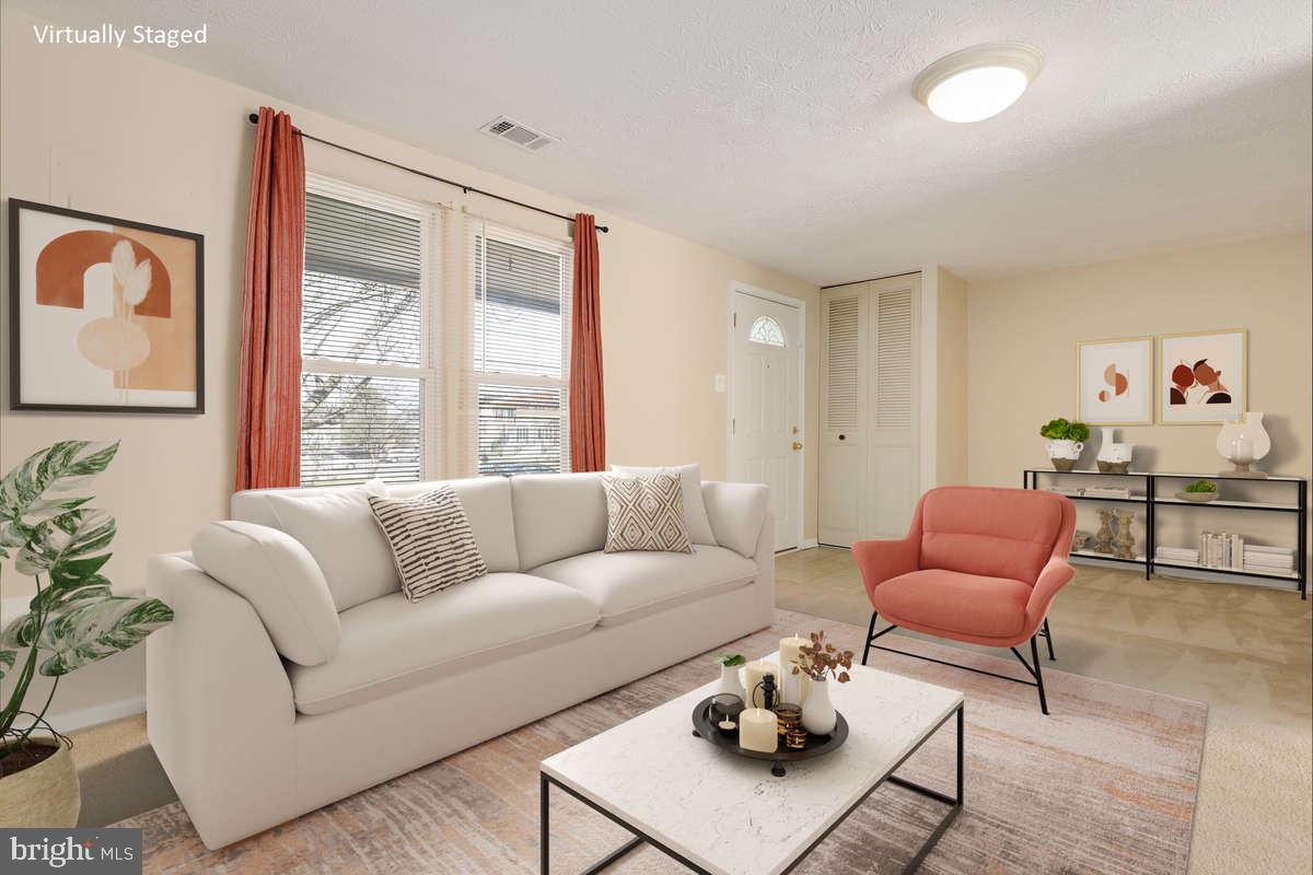 1349 David Lane Frederick, MD 21703 - Photo 3 of 24 a living room with furniture and a large window