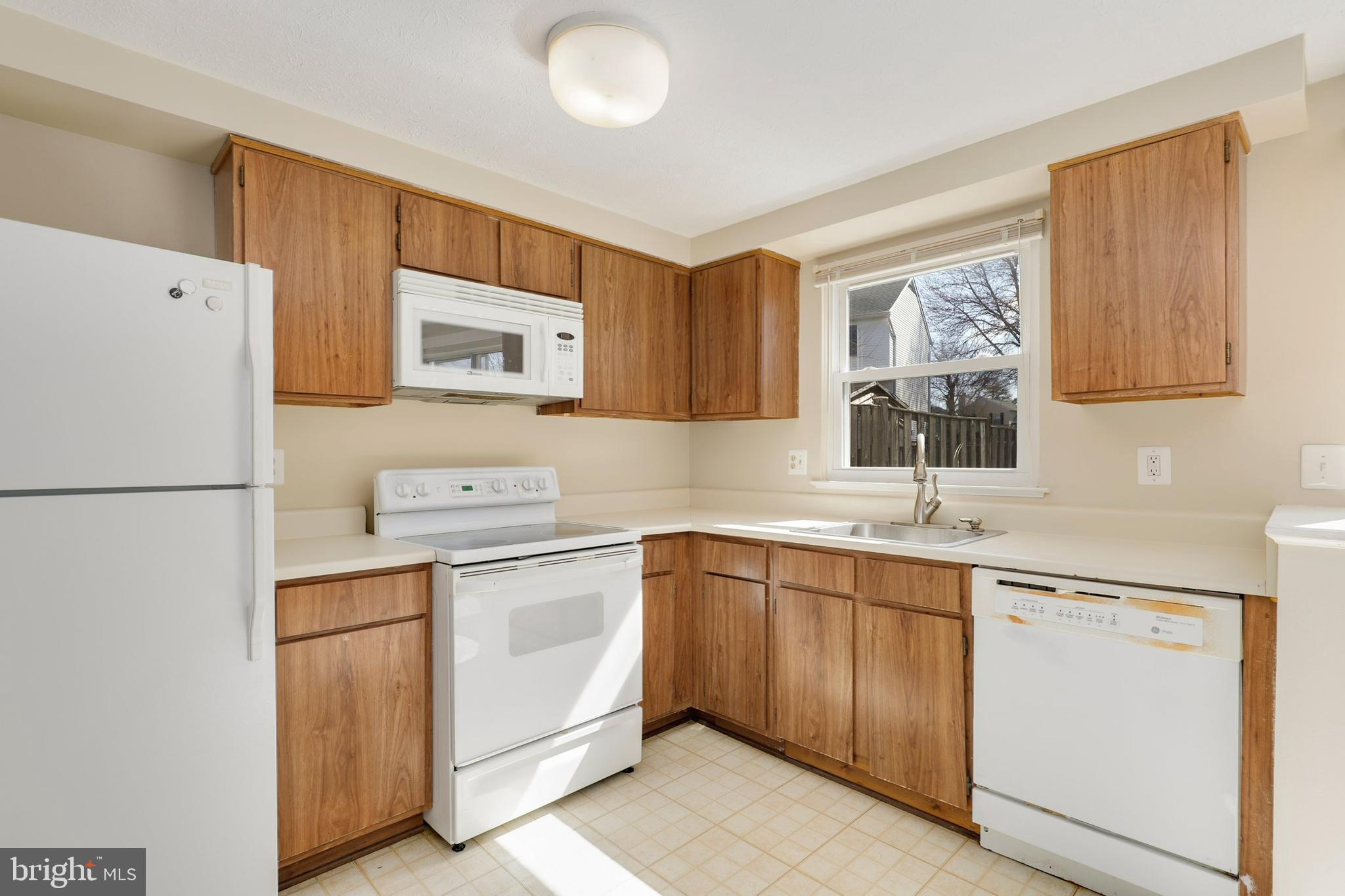 1349 David Lane Frederick, MD 21703 - Photo 8 of 24 a kitchen with a sink cabinets and refrigerator