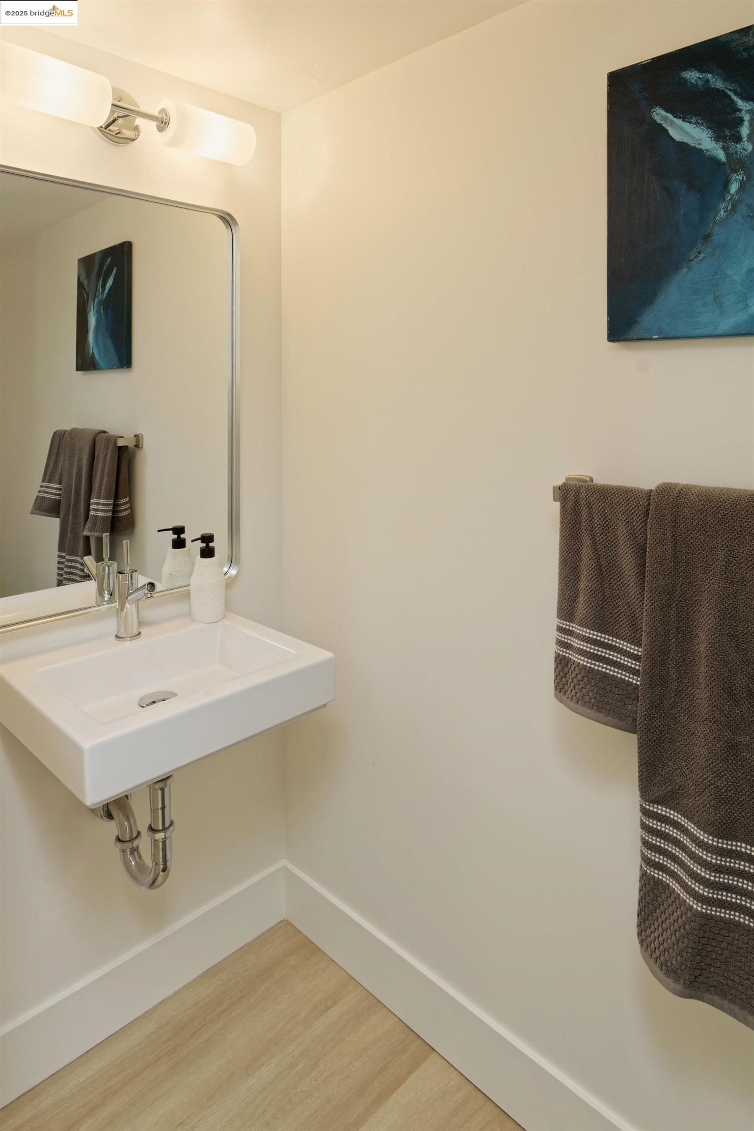 1201 Pine Street, Unit 315 Oakland, CA 94607 - Photo 15 of 41 Bathroom featuring light wood-style floors and baseboards