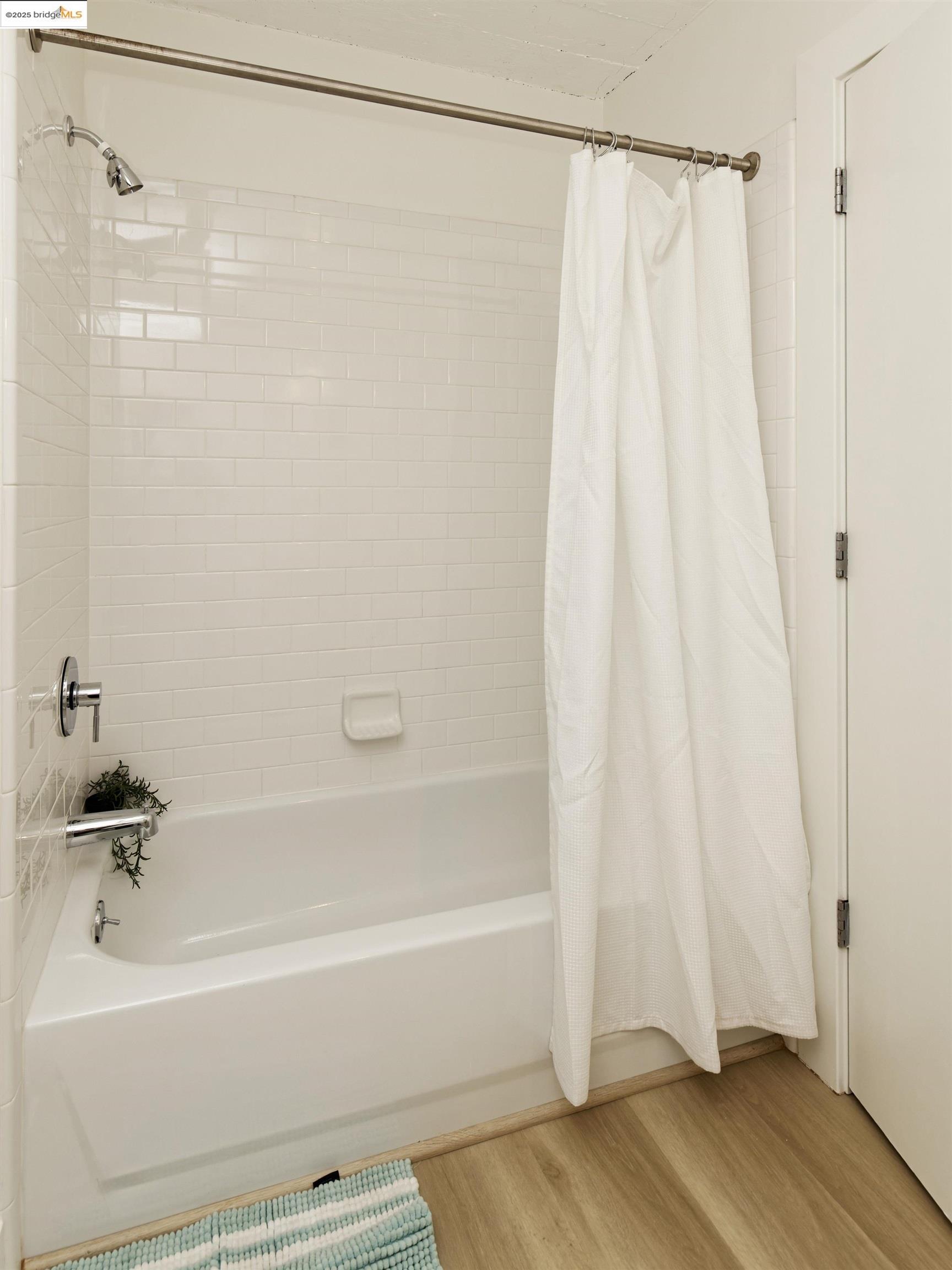 1201 Pine Street, Unit 315 Oakland, CA 94607 - Photo 22 of 41 Bathroom with shower / bath combo and light wood-style flooring