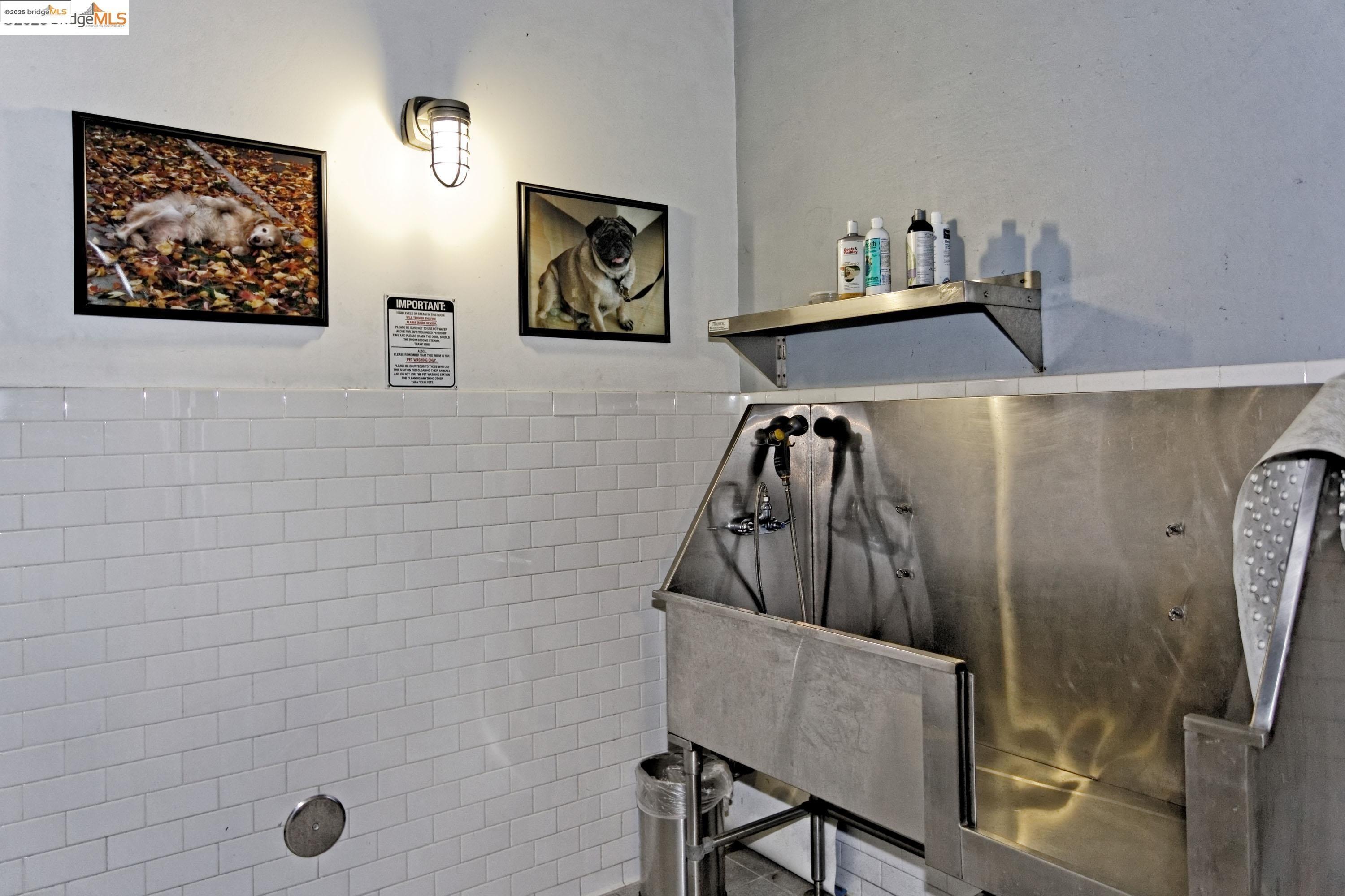 1201 Pine Street, Unit 315 Oakland, CA 94607 - Photo 39 of 41 Misc room with pet washing area, tile walls, and a wainscoted wall