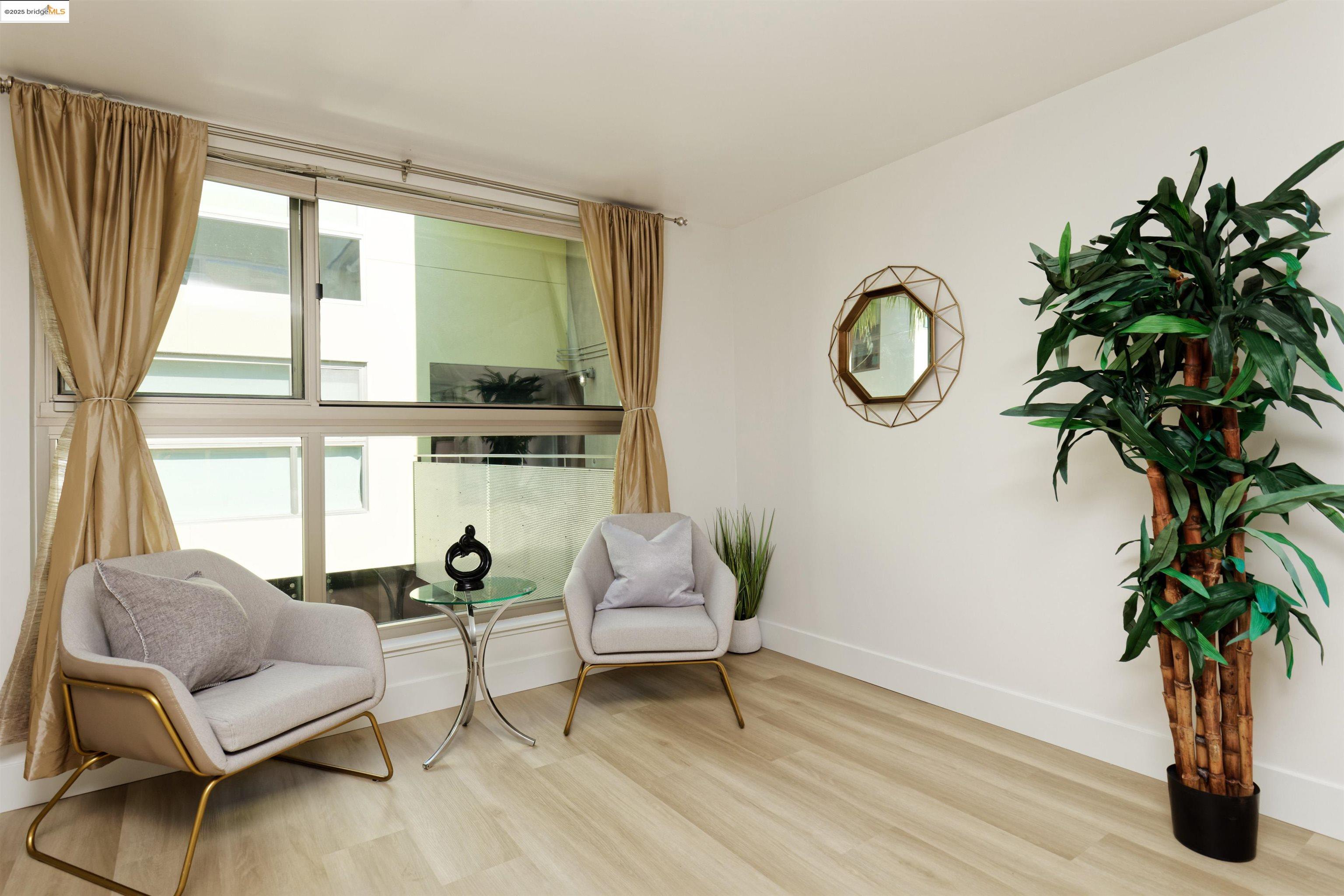 1201 Pine Street, Unit 315 Oakland, CA 94607 - Photo 6 of 41 Living area with wood finished floors