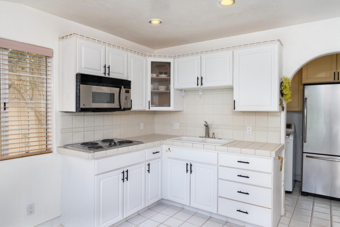 0 2nd Avenue Carmel, CA 93923 - Photo 5 of 15 a kitchen with white cabinets stainless steel appliances and sink