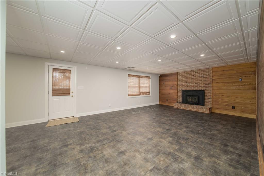 4400 Preston Point High Point, NC 27265 - Photo 35 of 49 Recreation Room, Solid Cypress Wood Paneling, Wood Burning Stove, Basement.