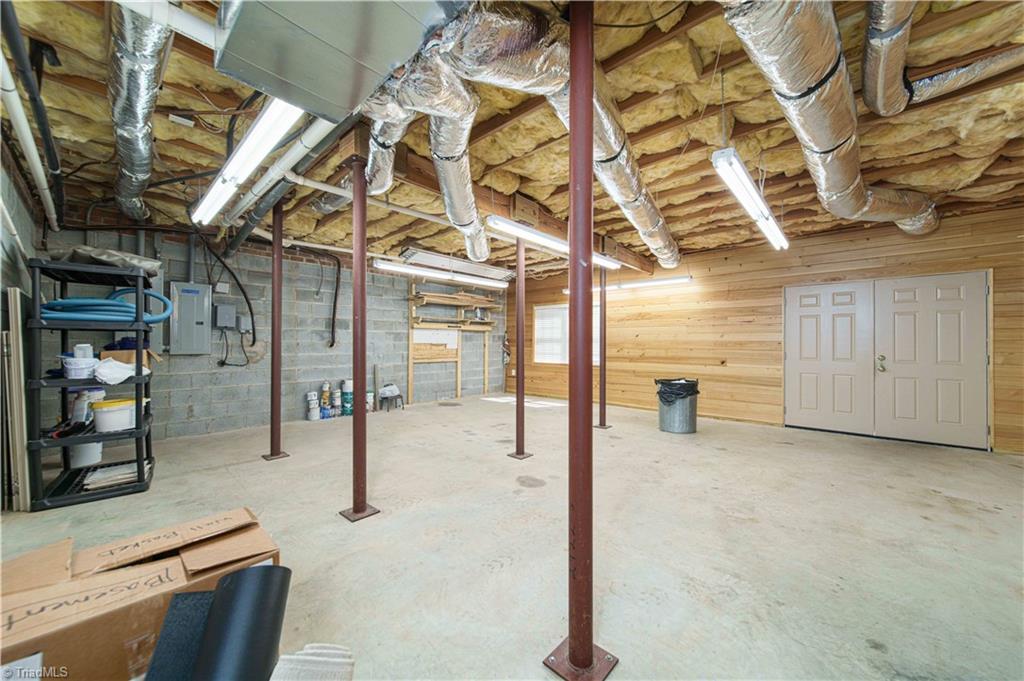 4400 Preston Point High Point, NC 27265 - Photo 39 of 49 Workshop, Prewired with 220 outlets, Solid Cypress wood paneling, Basement.