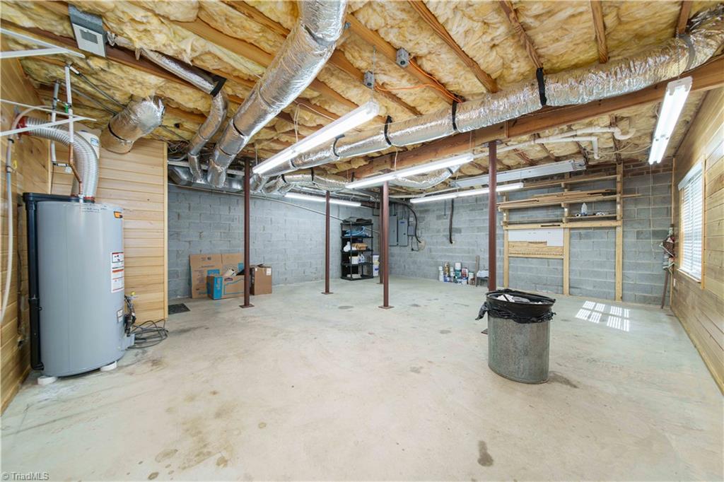 4400 Preston Point High Point, NC 27265 - Photo 40 of 49 Workshop, Prewired with 220 outlets, Solid Cypress wood paneling, Basement.