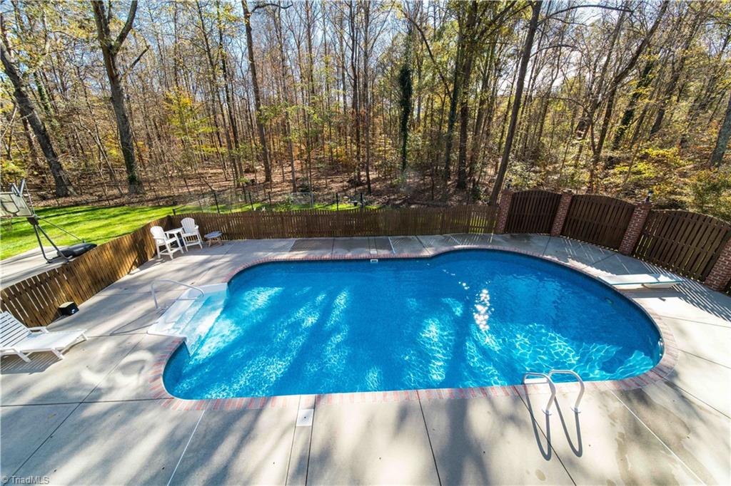 4400 Preston Point High Point, NC 27265 - Photo 42 of 49 Heated Salt Water Pool with view to garden beds.
