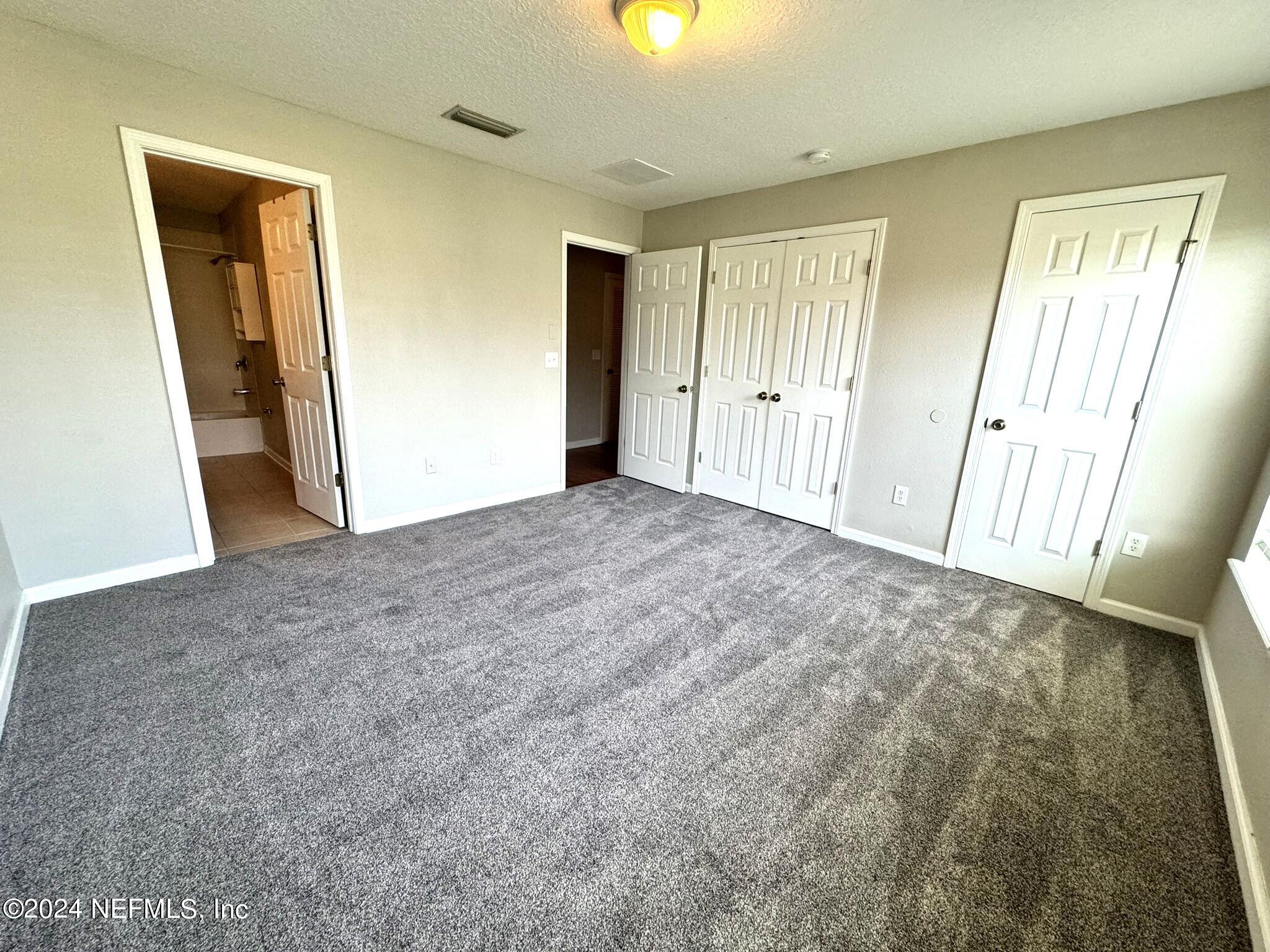 1500 Calming Water Drive, Unit 1003 Fleming Island, FL 32003 - Photo 5 of 13 a view of an empty room and a window