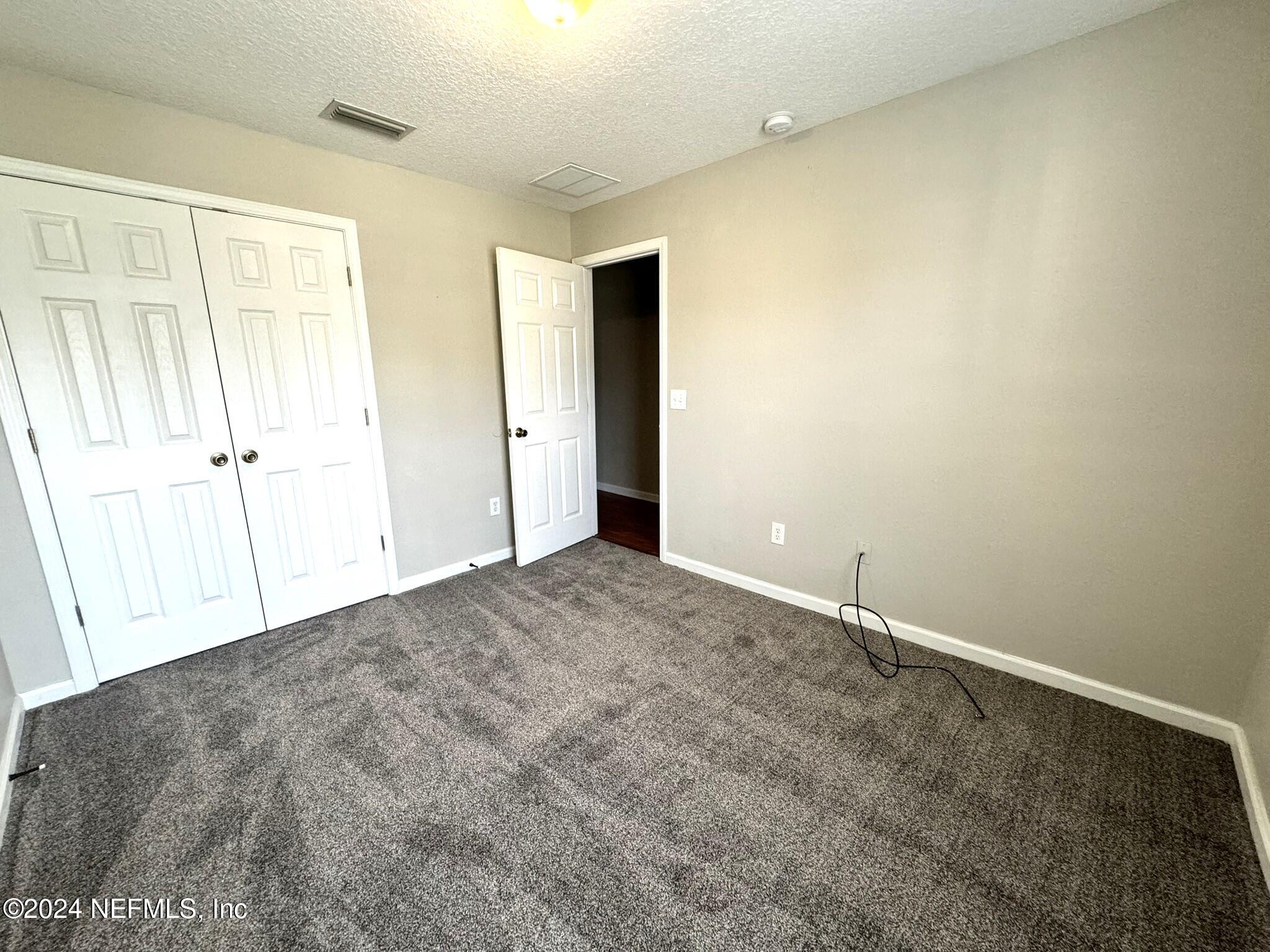 1500 Calming Water Drive, Unit 1003 Fleming Island, FL 32003 - Photo 9 of 13 a view of an empty room