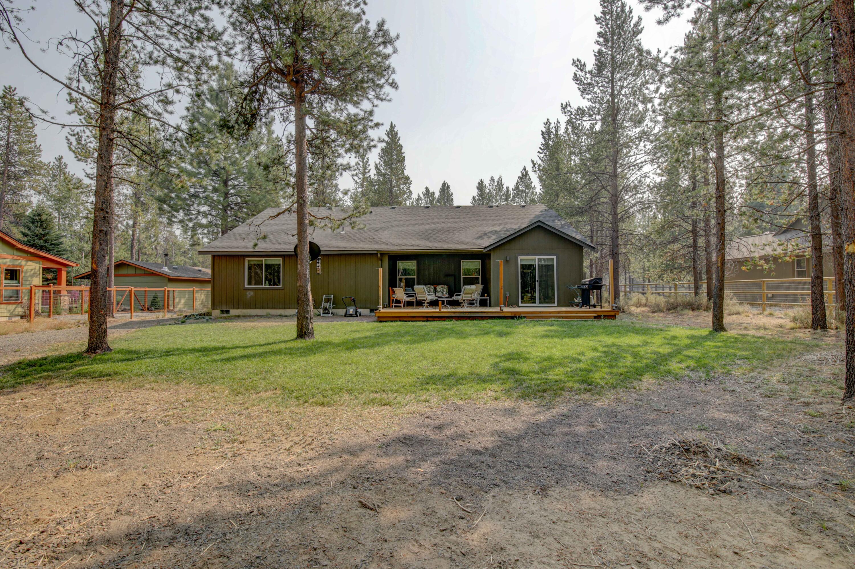 17160 Elsinore Road Bend, OR 97707 - Photo 29 of 47 a front view of a house with a yard and trees