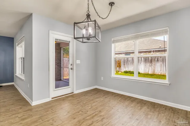 wooden floor and a window in a room