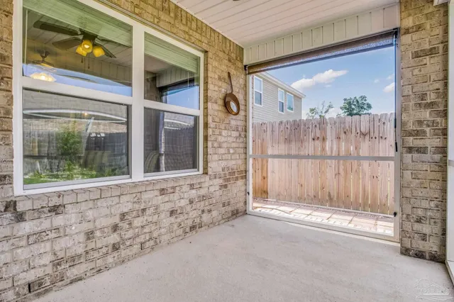 a view of a brick house with a large window