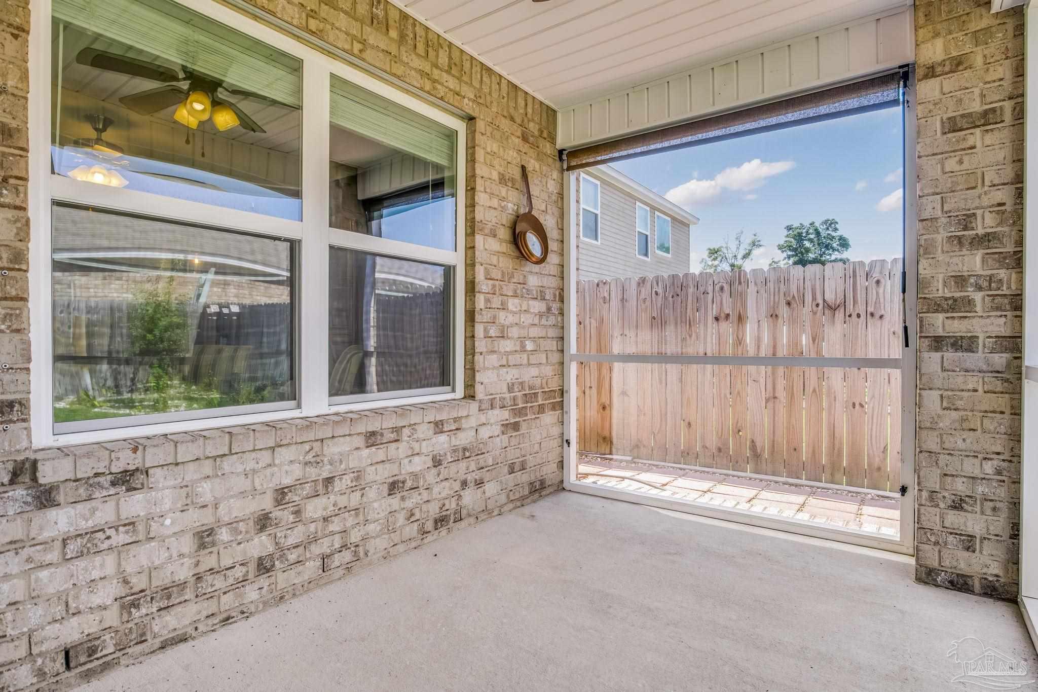 4706 Apple Field Way Milton, FL 32571 - Photo 16 of 52 wooden floor and a window in a room