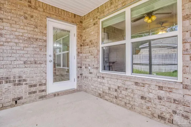 a balcony with view of an outdoor space