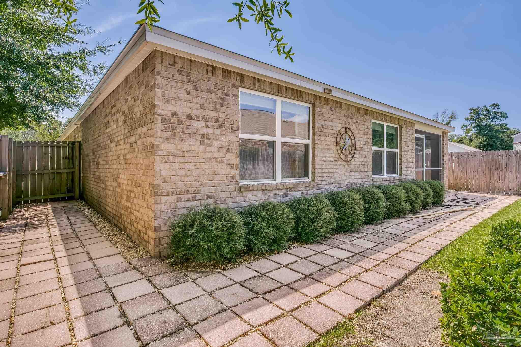 4706 Apple Field Way Milton, FL 32571 - Photo 21 of 52 a view of backyard with potted plants