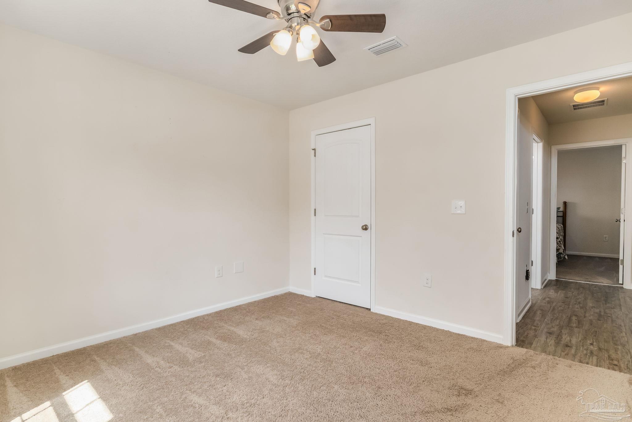 4706 Apple Field Way Milton, FL 32571 - Photo 27 of 52 wooden floor in an empty room