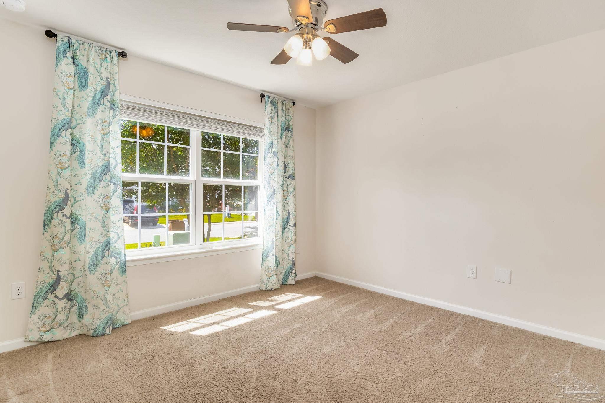 4706 Apple Field Way Milton, FL 32571 - Photo 28 of 52 a view of an empty room with a window