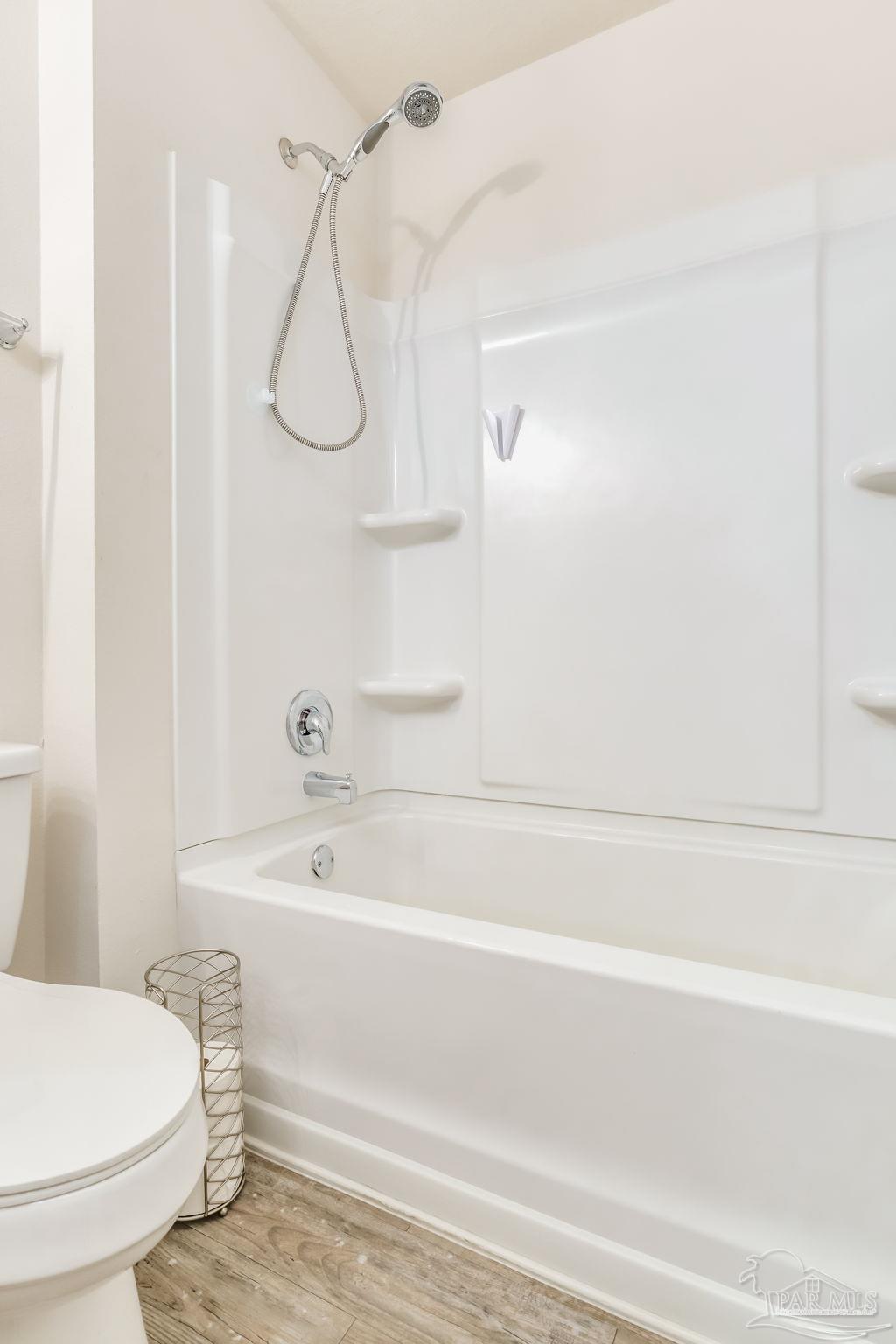 4706 Apple Field Way Milton, FL 32571 - Photo 34 of 52 a bathroom with a toilet and a bath tub