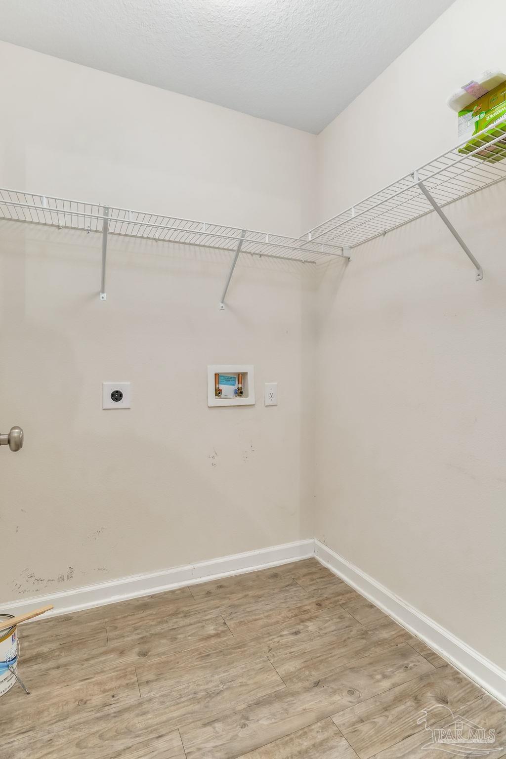 4706 Apple Field Way Milton, FL 32571 - Photo 36 of 52 a view of a room with racks on the wall