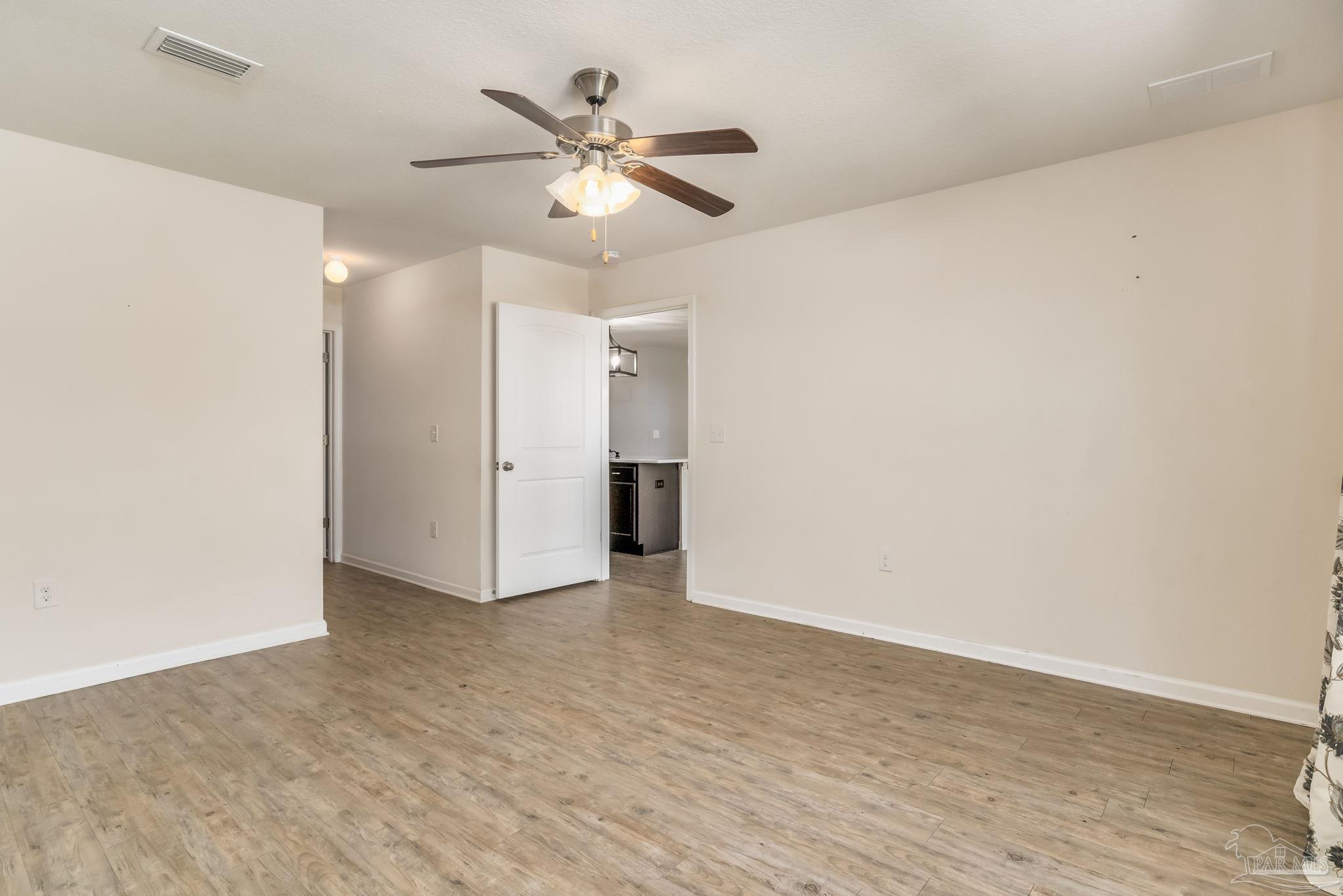 4706 Apple Field Way Milton, FL 32571 - Photo 39 of 52 wooden floor in an empty room
