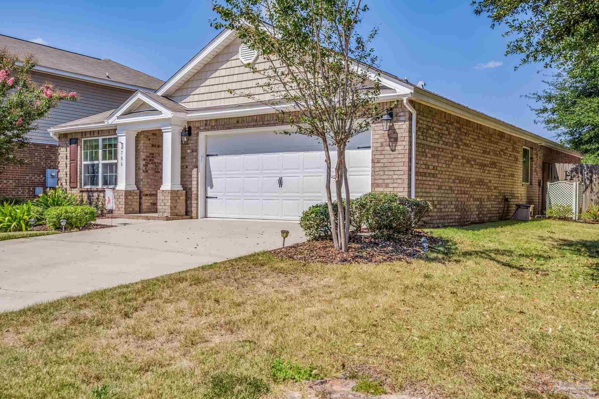 4706 Apple Field Way Milton, FL 32571 - Photo 46 of 52 a front view of a house with garden