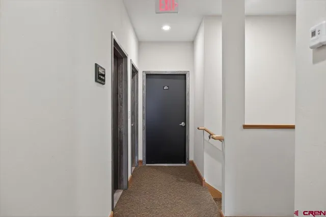 a view of a hallway with closet