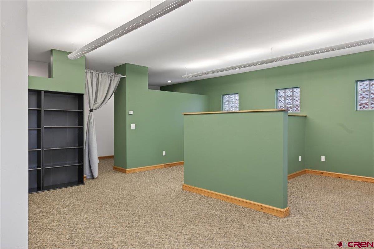 653 North Cora Street, Unit 201 Ridgway, CO 81432 - Photo 14 of 18 a view of a room with a refrigerator and cabinets