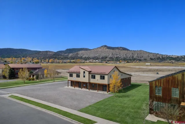 a view of house with outdoor space and river