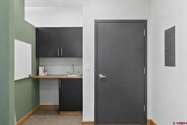 a bathroom with a sink and mirror