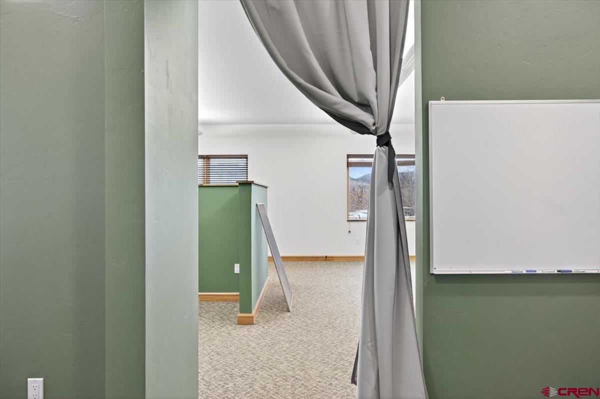 653 North Cora Street, Unit 201 Ridgway, CO 81432 - Photo 5 of 18 a view of a hallway with staircase