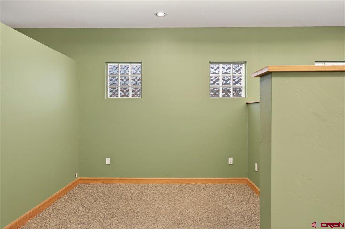 653 North Cora Street, Unit 201 Ridgway, CO 81432 - Photo 9 of 18 a view of a blue wall with a refrigerator
