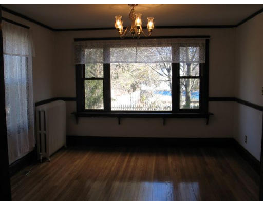 269 Weston Road Wellesley, MA 02482 - Photo 5 of 6 a view of wooden floor and windows in a room