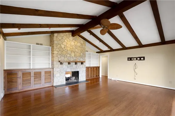 a kitchen with stainless steel appliances granite countertop wooden cabinets a sink and dishwasher