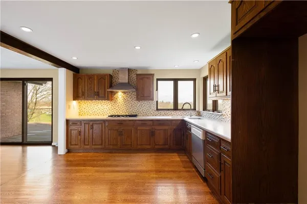 a view of an empty room with glass door