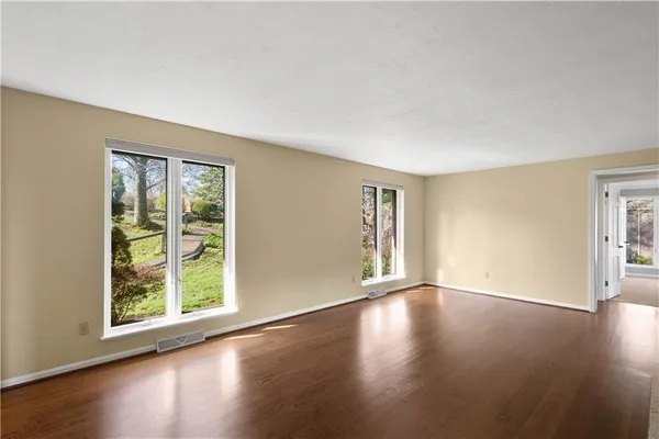 a view of a livingroom with a ceiling fan and window